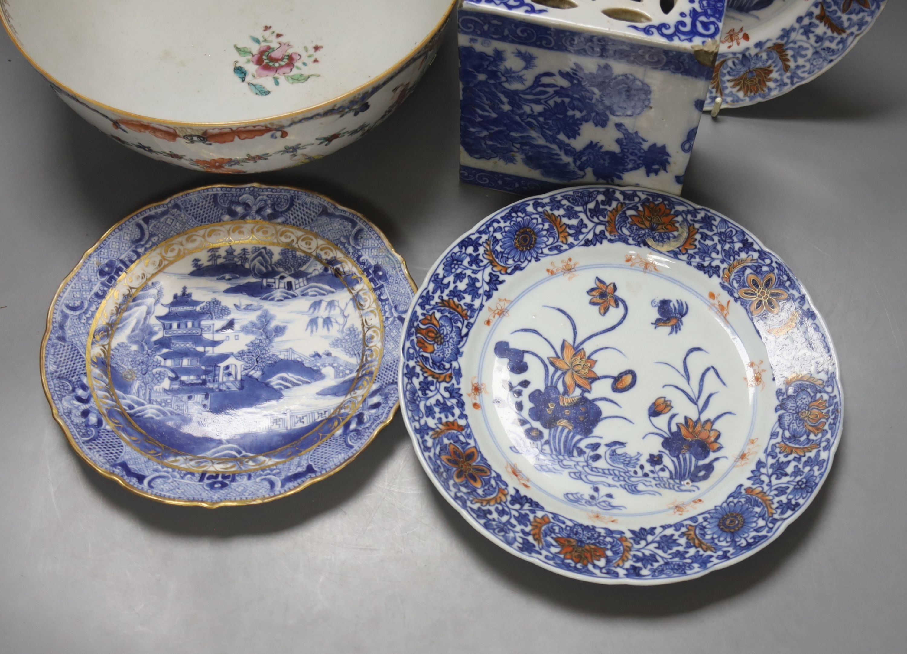 A Chinese blue and white pillow, an 18th century Chinese export bowl, diameter 26cm, and three similar plates